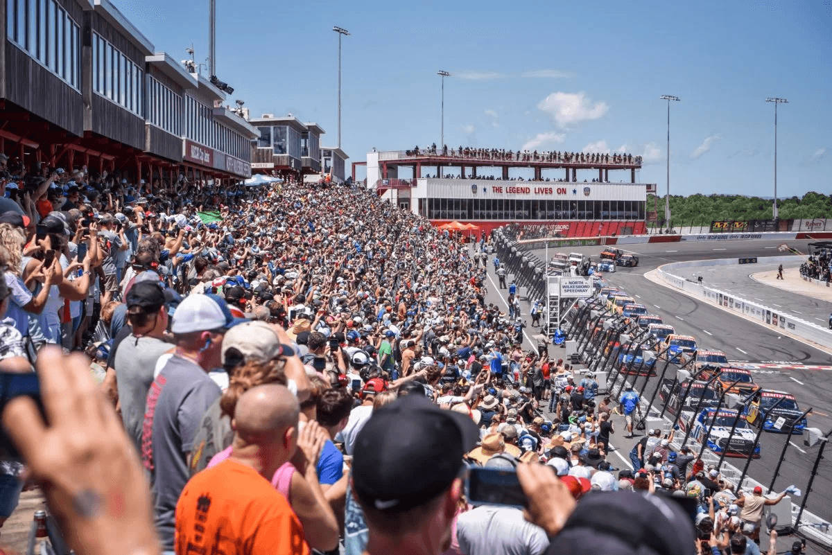 Fans fill the grandstand alongside the race track